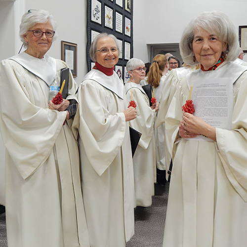 Choir members line up before heading into the sanctuary